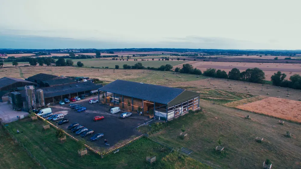 Aerial view of the barns and pasture at Lopemede Farm