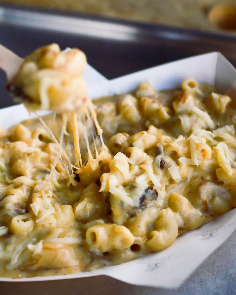 Three cheese macaroni cheese served in a paper tray